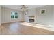 Spacious living room featuring modern fireplace, ceiling fan, and bright natural light at 72 Glenwood Pl, Kenly, NC 27542