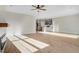 Living room with fireplace, ceiling fan, and modern flooring for an open feel at 72 Glenwood Pl, Kenly, NC 27542