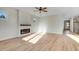Living room with a ceiling fan, fireplace, and modern flooring for an open feel at 72 Glenwood Pl, Kenly, NC 27542