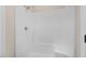 A clean white shower unit with built-in seat provides comfortable convenience at 72 Glenwood Pl, Kenly, NC 27542