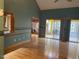 Spacious living room featuring hardwood floors and large windows with views of the yard at 80 White Deer Ln, Henderson, NC 27537