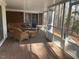 Inviting screened porch, furnished with wicker seating, offers a peaceful outdoor retreat at 80 White Deer Ln, Henderson, NC 27537