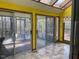 Cozy sunroom with large windows and tile flooring, perfect for relaxing at 80 White Deer Ln, Henderson, NC 27537