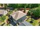Aerial view of the home, showcasing its well-maintained yard, mature trees, and neighborhood setting at 8840 Forester Ln, Apex, NC 27539