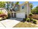 Inviting home with stone accents, a two-car garage, and a meticulously maintained front yard at 8840 Forester Ln, Apex, NC 27539