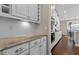 Gourmet kitchen showcasing marble countertops, subway tile backsplash and stainless steel appliances at 8840 Forester Ln, Apex, NC 27539