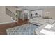 Inviting living space with hardwood floors, staircase, and a bright, open floor plan at 8840 Forester Ln, Apex, NC 27539