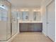 Spacious bathroom with double vanity and glass-enclosed shower offers a luxurious feel at 100 Highveld Ave, Chapel Hill, NC 27516