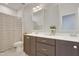 Bathroom featuring dual sinks, with grey cabinets, and modern fixtures at 100 Highveld Ave, Chapel Hill, NC 27516