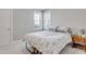 A cozy bedroom with a bed, two windows providing natural light, and minimalist decorations for relaxation at 100 Highveld Ave, Chapel Hill, NC 27516