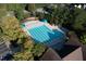 An aerial shot of the community pool with sun loungers and umbrellas at 100 Highveld Ave, Chapel Hill, NC 27516