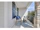 Cozy front porch with stylish seating, a patterned rug, and stone pillars at 100 Highveld Ave, Chapel Hill, NC 27516