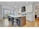 Spacious eat-in kitchen with a large island, pendant lights, and stainless steel appliances at 100 Highveld Ave, Chapel Hill, NC 27516