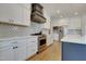 Bright kitchen with stainless steel appliances, gas range, and white cabinets at 100 Highveld Ave, Chapel Hill, NC 27516