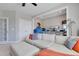 Living room with a large sectional sofa, display cases, and an open floor plan at 100 Highveld Ave, Chapel Hill, NC 27516