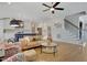 Open-concept living room flows into a modern kitchen with hardwood floors and plenty of natural light at 100 Highveld Ave, Chapel Hill, NC 27516