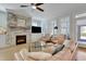 Inviting living room with stone fireplace, hardwood floors, comfortable seating, and plenty of natural light at 100 Highveld Ave, Chapel Hill, NC 27516