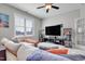 Comfortable living room featuring a sectional sofa, entertainment center, and modern décor at 100 Highveld Ave, Chapel Hill, NC 27516