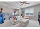Spacious living room with a large sofa, ceiling fan, and lots of natural light at 100 Highveld Ave, Chapel Hill, NC 27516
