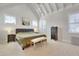 Spacious primary bedroom with vaulted ceilings, neutral walls, and ample natural light at 100 Highveld Ave, Chapel Hill, NC 27516