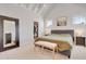 Bright primary bedroom boasts vaulted ceilings, ensuite closet, and light-filled windows at 100 Highveld Ave, Chapel Hill, NC 27516