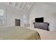 View of the primary bedroom featuring vaulted ceilings, neutral walls and furniture, and TV at 100 Highveld Ave, Chapel Hill, NC 27516
