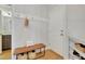 This mudroom features a bench with storage, coat hooks, and light hardwood flooring that enhance its functionality at 100 Highveld Ave, Chapel Hill, NC 27516