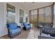 Inviting screened patio with comfortable seating, perfect for enjoying the outdoors in comfort at 100 Highveld Ave, Chapel Hill, NC 27516