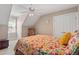 Cozy bedroom featuring a floral bedspread and an overhead fan, creating a comfortable atmosphere at 10320 Crisp Dr, Raleigh, NC 27614