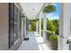 Inviting front porch with columns, hanging plants, and ample space at 10320 Crisp Dr, Raleigh, NC 27614