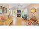 Inviting living room with a cozy fireplace, TV, beautiful flooring, and comfortable seating arrangements at 10320 Crisp Dr, Raleigh, NC 27614