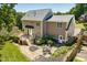 Spacious backyard featuring a deck, patio area with dining set, and lush landscaping at 10320 Crisp Dr, Raleigh, NC 27614