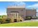 View of the rear of the house, highlighting the deck and well-maintained lawn at 10320 Crisp Dr, Raleigh, NC 27614