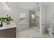 Modern bathroom features a sleek vanity, tiled floors, and a glass-enclosed shower with tiled surround at 105 S Mule Way # 89, Benson, NC 27504