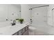 Bathroom featuring a combined bathtub and shower, sleek fixtures, and a stylish vanity at 105 S Mule Way # 89, Benson, NC 27504