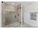 Modern bathroom features a sleek glass shower door and tiled shower with black hardware at 105 S Mule Way # 89, Benson, NC 27504