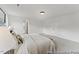 Bright bedroom featuring neutral tones, carpet flooring, and ample natural light from the large windows at 105 S Mule Way # 89, Benson, NC 27504