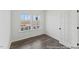 Bedroom with hardwood floors and two large windows letting in natural light at 105 S Mule Way # 89, Benson, NC 27504