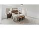 Bright bedroom featuring neutral tones, carpet flooring, and ample natural light from the large windows at 105 S Mule Way # 89, Benson, NC 27504