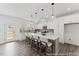 Bright kitchen featuring a center island, pendant lighting, stainless appliances and views to backyard with door to the outside at 105 S Mule Way # 89, Benson, NC 27504