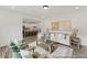 Open living room showcasing views into the kitchen and features neutral furniture, wood accents, and an area rug at 105 S Mule Way # 89, Benson, NC 27504