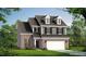 Charming two-story home with a brick and siding exterior, dormer windows, and a two-car garage at 1091 Channel Drop Lp, Zebulon, NC 27597