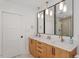 Modern bathroom with double sink vanity, three pendant lights, and walk-in shower at 1112 Watauga Street St, Raleigh, NC 27604