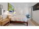 Serene bedroom featuring a plush bed, modern decor, and ample natural light at 1112 Watauga Street St, Raleigh, NC 27604