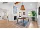 Bright dining room with a large table, fireplace, and hardwood floors at 1112 Watauga Street St, Raleigh, NC 27604