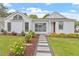 Charming home with well-manicured lawn, beautiful landscaping, and inviting walkway at 1112 Watauga Street St, Raleigh, NC 27604