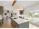 Modern kitchen with large island, stainless steel appliances, and stylish pendant lighting at 1112 Watauga Street St, Raleigh, NC 27604