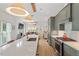 Modern kitchen featuring a large island, stainless steel appliances, and seamless flow to the living area at 1112 Watauga Street St, Raleigh, NC 27604