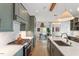 Modern kitchen with large island, stainless steel appliances, and stylish pendant lighting at 1112 Watauga Street St, Raleigh, NC 27604