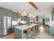 Modern kitchen with large island, stainless steel appliances, and stylish pendant lighting at 1112 Watauga Street St, Raleigh, NC 27604